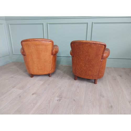 512 - Pair of his and hers French hand dyed leather upholstered tub chairs raised on square tapered legs {... 