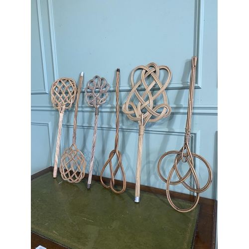 517 - Set of six early 20th C. wicker carpet beaters {Approx. 78 cm H}.