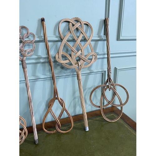 517 - Set of six early 20th C. wicker carpet beaters {Approx. 78 cm H}.