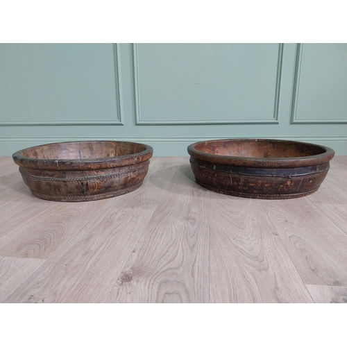 521 - Two wooden and metal bound bowls {16 cm H x 65 cm Dia. AND 16 cm H x 59 cm Dia.}.