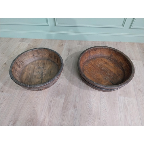 521 - Two wooden and metal bound bowls {16 cm H x 65 cm Dia. AND 16 cm H x 59 cm Dia.}.