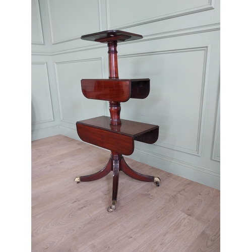 530 - Good quality Georgian mahogany three tiered dumb waiter raised on four out swept feet and brass cast... 