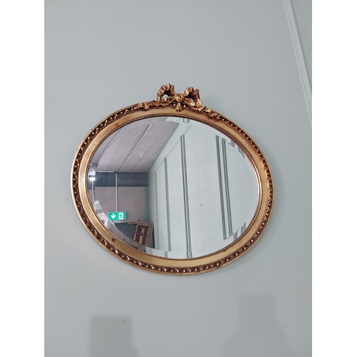 531 - French gilt oval wall mirror {51 cm H x 56 cm W}.