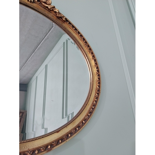 531 - French gilt oval wall mirror {51 cm H x 56 cm W}.