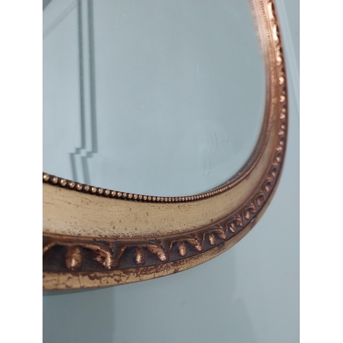 531 - French gilt oval wall mirror {51 cm H x 56 cm W}.