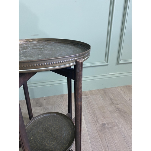 536 - Early 20th C. Middle Eastern oak coffee table with embossed brass top {52 cm H x 34 cm Dia.}.