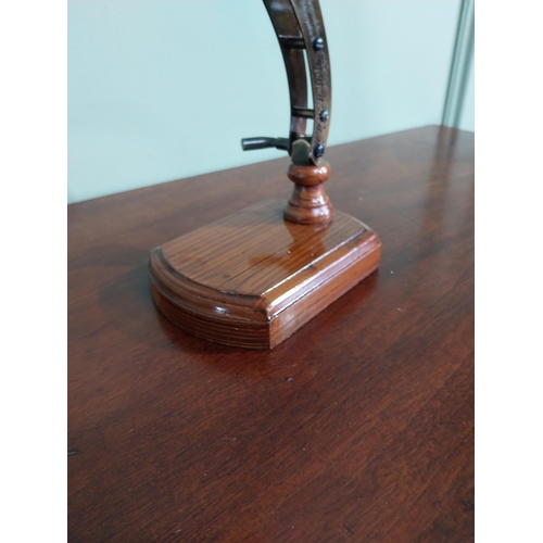 54 - Brass desk magnifying glass mounted on scumble pine base {18 cm H x 23 cm W x 10 cm D}.