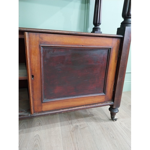 551 - Victorian mahogany dumbwaiter on reeded columns above two doors raised on turned legs {127 cm H x 12... 