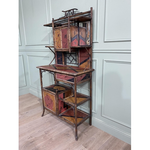 552 - 19th C. Oriental bamboo side cabinet with mirrored back about single drawers, open shelving and blin... 