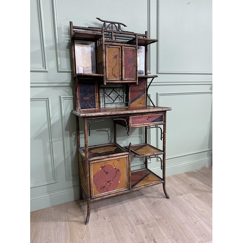 552 - 19th C. Oriental bamboo side cabinet with mirrored back about single drawers, open shelving and blin... 