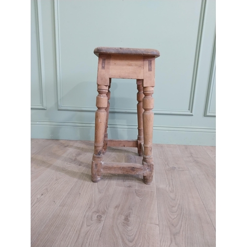 554 - Two early 20th C. pine stools raised on turned legs {60 cm H x 38 cm W x 30 cm D and 33 cm H x 22 cm... 