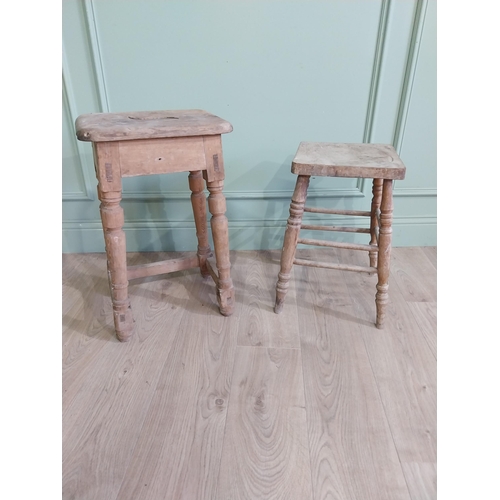 554 - Two early 20th C. pine stools raised on turned legs {60 cm H x 38 cm W x 30 cm D and 33 cm H x 22 cm... 