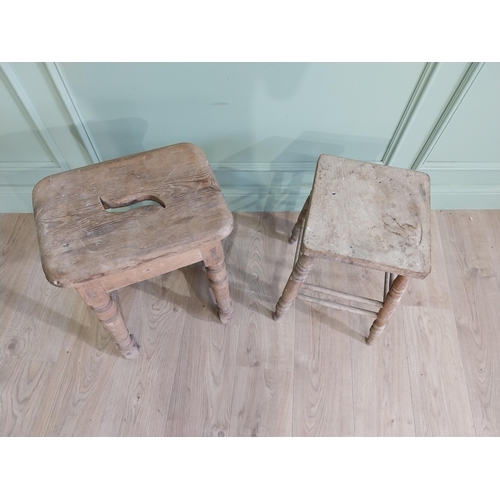 554 - Two early 20th C. pine stools raised on turned legs {60 cm H x 38 cm W x 30 cm D and 33 cm H x 22 cm... 