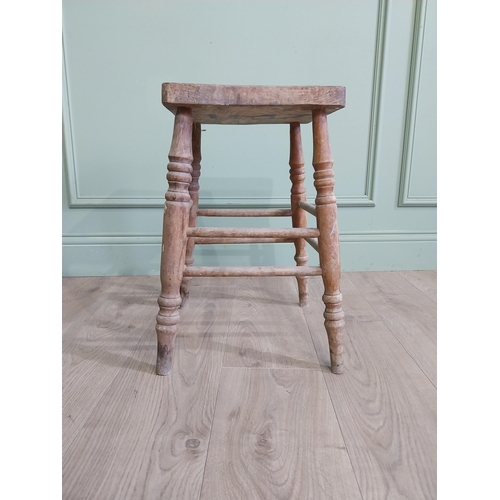 554 - Two early 20th C. pine stools raised on turned legs {60 cm H x 38 cm W x 30 cm D and 33 cm H x 22 cm... 