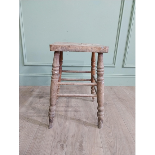 554 - Two early 20th C. pine stools raised on turned legs {60 cm H x 38 cm W x 30 cm D and 33 cm H x 22 cm... 