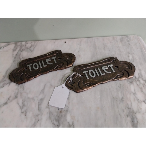 56 - Pair of cast iron Toilet signs in the Art Deco style {7 cm H x 18 cm W}.