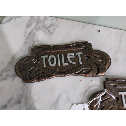 56 - Pair of cast iron Toilet signs in the Art Deco style {7 cm H x 18 cm W}.