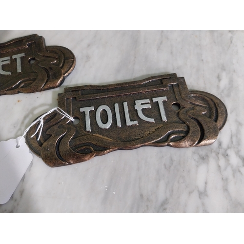 56 - Pair of cast iron Toilet signs in the Art Deco style {7 cm H x 18 cm W}.