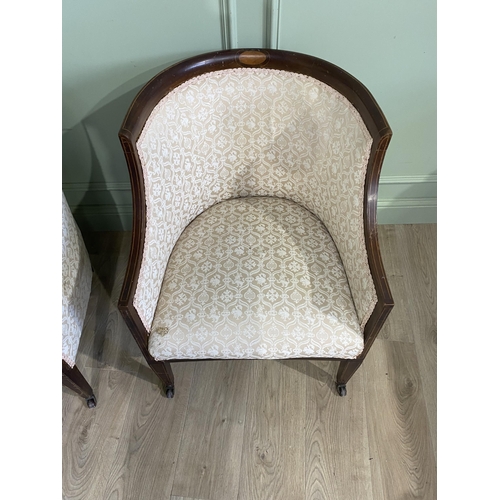 562 - Pair of Edwardian mahogany and satinwood inlaid upholstered armchairs raised on square tapered legs ... 