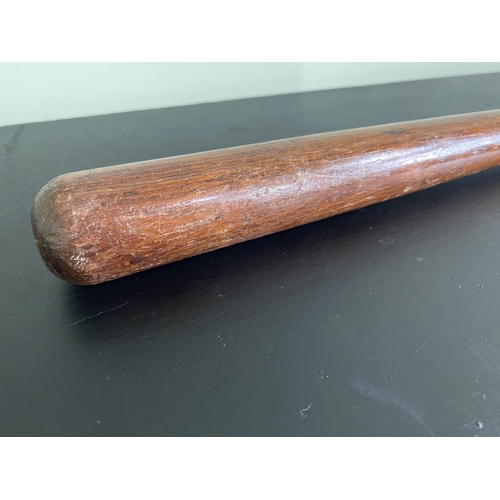 573 - Edwardian mahogany truncheon {40 cm L}.