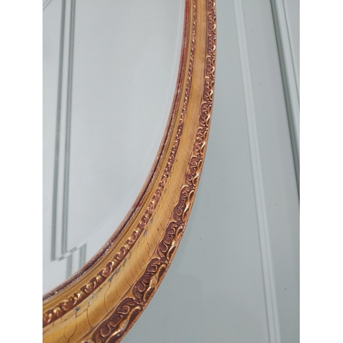 574 - Giltwood wall mirror in the 19th C. style {97 cm H x 51 cm W}.