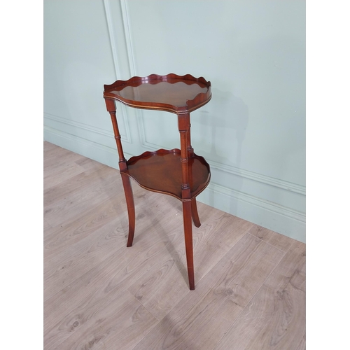 578 - Good quality mahogany two tiered lamp table raised on turned columns and square tapered legs {71 cm ... 