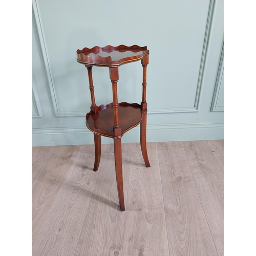 578 - Good quality mahogany two tiered lamp table raised on turned columns and square tapered legs {71 cm ... 