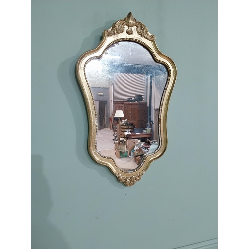 58 - French gilt and carved wall mirror in the Victorian style. {68 cm H x 40 cm W}.