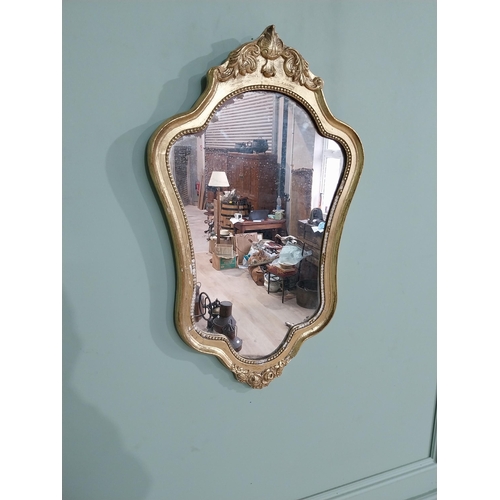 58 - French gilt and carved wall mirror in the Victorian style. {68 cm H x 40 cm W}.