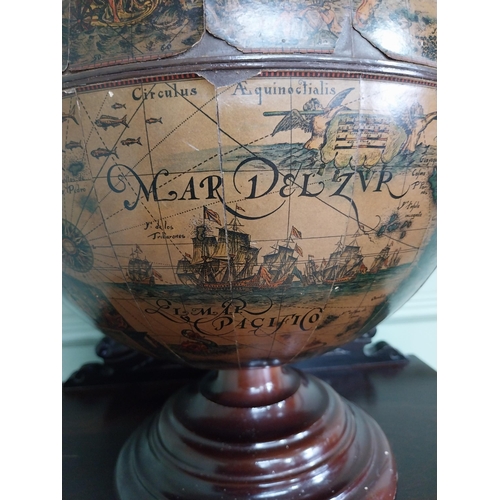 582 - Globe on wooden base in the form of a drinks' cabinet. {47 cm H x 32 cm Dia.}.