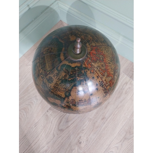 582 - Globe on wooden base in the form of a drinks' cabinet. {47 cm H x 32 cm Dia.}.