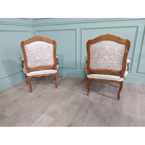 583 - Pair of Edwardian French carved walnut open armchairs with silk embroidered upholstery raised on cab... 