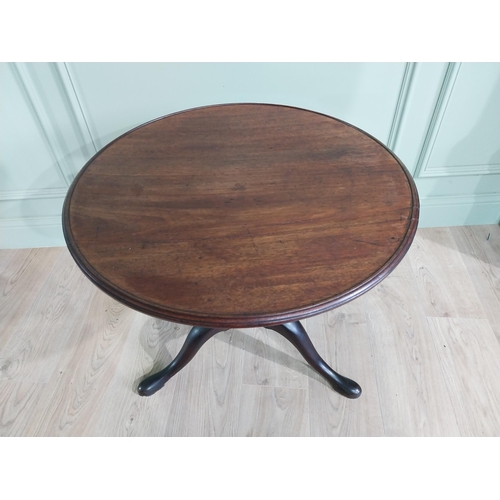 596 - Irish Georgian mahogany tilt top occasional table with dished top raised on turned column and three ... 