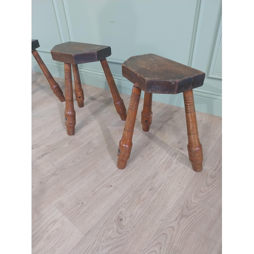 597 - Set of four early 20th C. oak stools raised on turned splayed legs {45 cm H x 41 cm W x 30 cm D}.