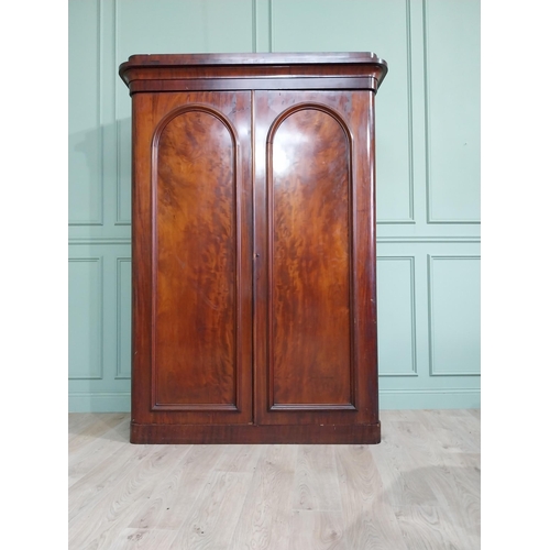 601 - 19th C. mahogany two door wardrobe with single long drawer raised on platform base {215 cm H x 150 c... 