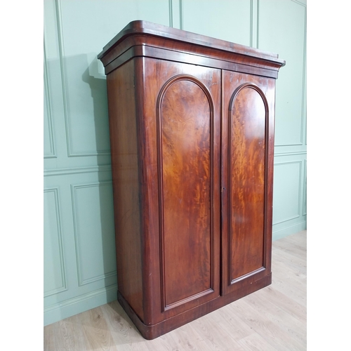 601 - 19th C. mahogany two door wardrobe with single long drawer raised on platform base {215 cm H x 150 c... 