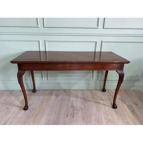 608 - Edwardian mahogany console table raised on carved cabriole legs {87 cm H x 168 cm W x 69 cm D}.