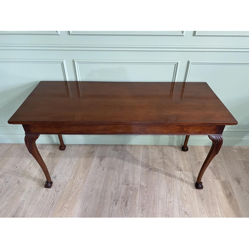 608 - Edwardian mahogany console table raised on carved cabriole legs {87 cm H x 168 cm W x 69 cm D}.