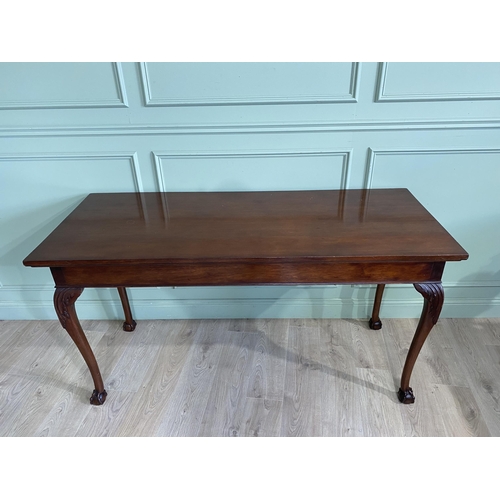 608 - Edwardian mahogany console table raised on carved cabriole legs {87 cm H x 168 cm W x 69 cm D}.