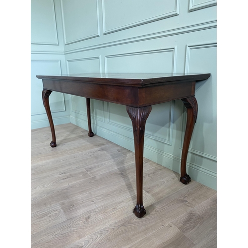 608 - Edwardian mahogany console table raised on carved cabriole legs {87 cm H x 168 cm W x 69 cm D}.