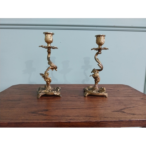 63 - Pair of gilded bronze candlesticks in the Rococo style {23 cm H x 10 cm W x 9 cm D}.