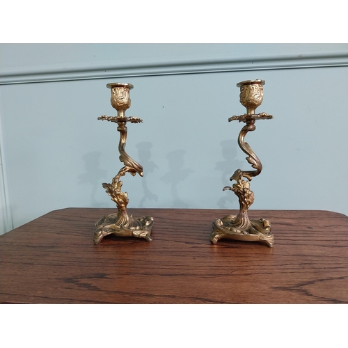 63 - Pair of gilded bronze candlesticks in the Rococo style {23 cm H x 10 cm W x 9 cm D}.