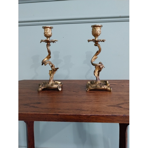 63 - Pair of gilded bronze candlesticks in the Rococo style {23 cm H x 10 cm W x 9 cm D}.