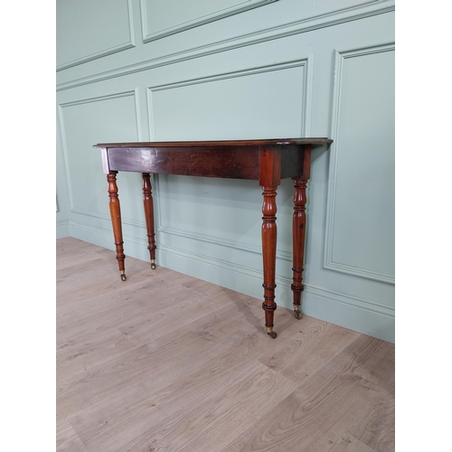 636 - Good quality 19th C. mahogany side table raised on turned legs and brass castors {77 cm H x 122 cm W... 