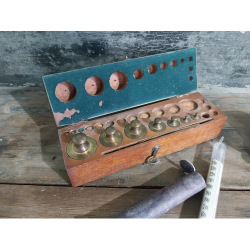 641 - Early 20th C. brass weights, thermometer and clock.