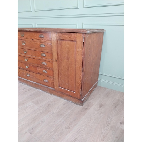 654 - Early 20th C. pitch pine Architects cabinet and drawers with six long drawers flanked by two blind d... 