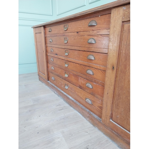 654 - Early 20th C. pitch pine Architects cabinet and drawers with six long drawers flanked by two blind d... 