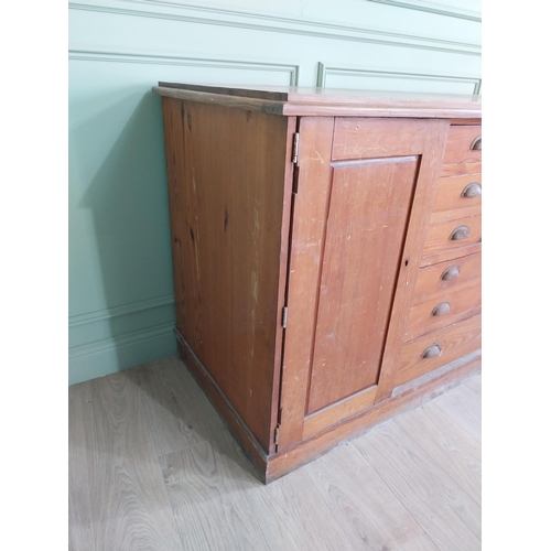 654 - Early 20th C. pitch pine Architects cabinet and drawers with six long drawers flanked by two blind d... 