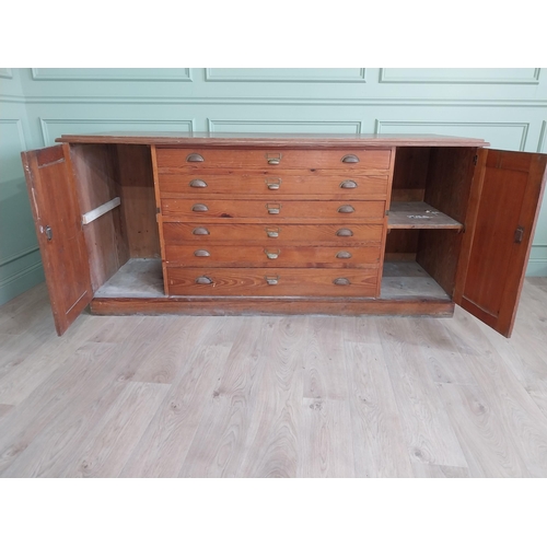 654 - Early 20th C. pitch pine Architects cabinet and drawers with six long drawers flanked by two blind d... 