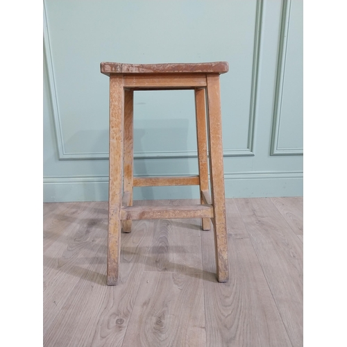 667 - Two early 20th C. pine stools {61 cm H x 33 cm W x 30 cm D and 61 cm H x 33 cm W x 31 cm D}.